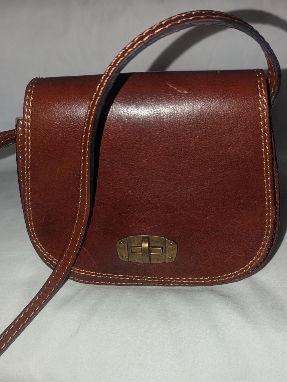 Vera Pelle Brown Leather Crossbody Saddle Bag with Brass Lock